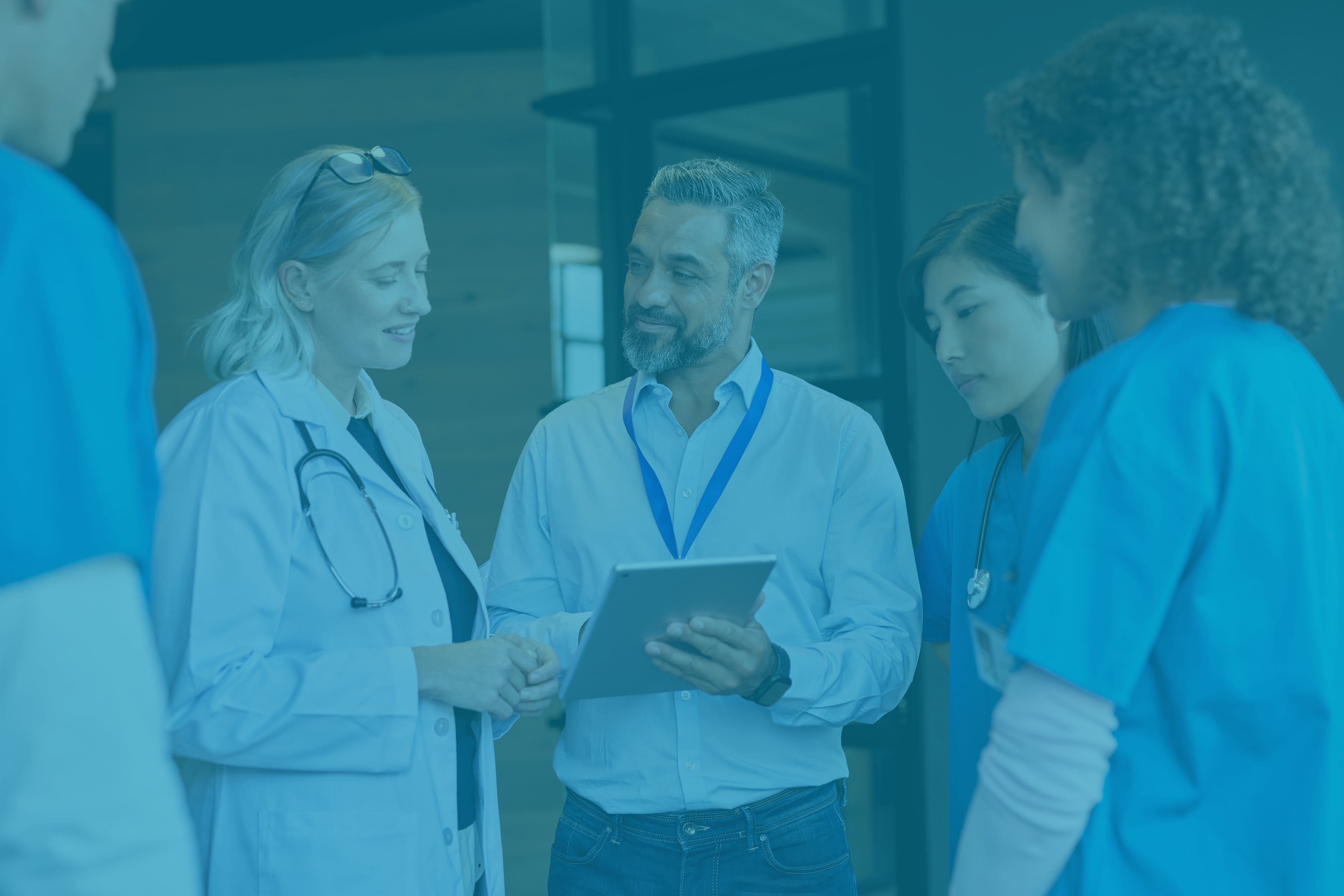 Five medical providers discussing notes for a patient